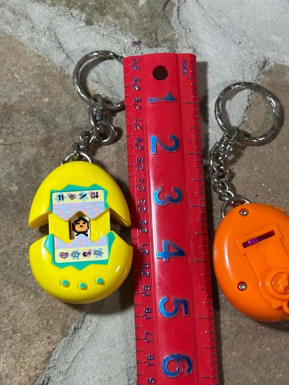 McDonalds Tamagotchi Keychains Orange and Yellow